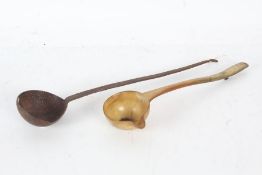 George II horn toddy ladle inset with a George II shilling together with a 19th century iron