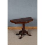 Victorian mahogany serpentine fronted side table with an unusual turned pillar above four legs