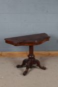 Victorian mahogany serpentine fronted side table with an unusual turned pillar above four legs