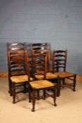 Matched set of six 19th Century ladder back dining chairs, to include two armchairs and four