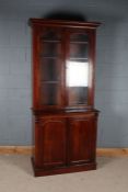 Victorian mahogany glazed bookcase, with a pair of glazed doors above a cabinet, 215cm high 95cm