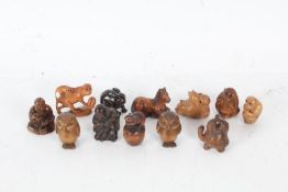 Twelve resin and wood netsukes, to include rabbit, owls, monkeys, horse, tortoises etc. (12)