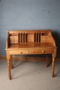 20th century pine desk, with eight drawers and various pigeonholes above turned legs, 110cm wide
