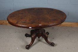 Victorian burr walnut loo table, the top with boxwood inlaid above a turned column and legs with