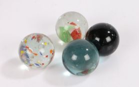 Four various glass marbles, to include a ribbon core example, 30mm diameter (4)