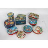 Collection of tins, mostly depicting children, a Christmas example, "The Nipper" by permission of