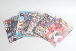 Nine Spiderman comics by Marvel, an edition of Wolverine, U.S. War Machine and The Mighty World of