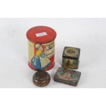 Four various tins, to include a money box of cylindrical form, Capstan Navy Cut example,