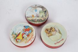 Three Huntley and Palmers biscuit tins, depicting Noddy, Mrs Tiggy-winkle and Winnie the Pooh,