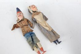 Punch and Judy dolls/puppets, each with wooden legs, circa late 19th/early 20th century, the heads