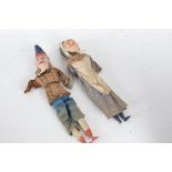 Punch and Judy dolls/puppets, each with wooden legs, circa late 19th/early 20th century, the heads