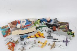 Collection of various toys, to include diecast planes, toy figures, a Merit Slinky in original