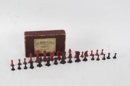 The Rose Chess No.1 set, with thirty-two lead pieces stained in red and black, in original box (32)