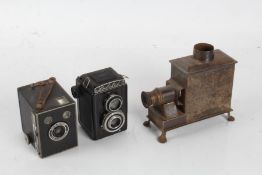D.R.G.M. tin plate magic lantern, 18.5cm long, together with a Brownie camera and a Lubitel