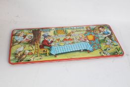 Alice in Wonderland paint set, housed in tinplate case, by Page of London, 51cm long