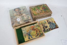Three early 20th century children's block sets, two depicting a sailor boy, one housed in original