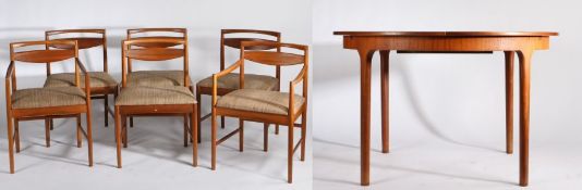 A.H. McIntosh & Co., teak extending dining table with a set of six chairs, comprising two carvers