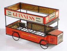 Mid 20th century Guinness Omnibus bottle crate, formed as a bus with printing on tinplate, 46cm