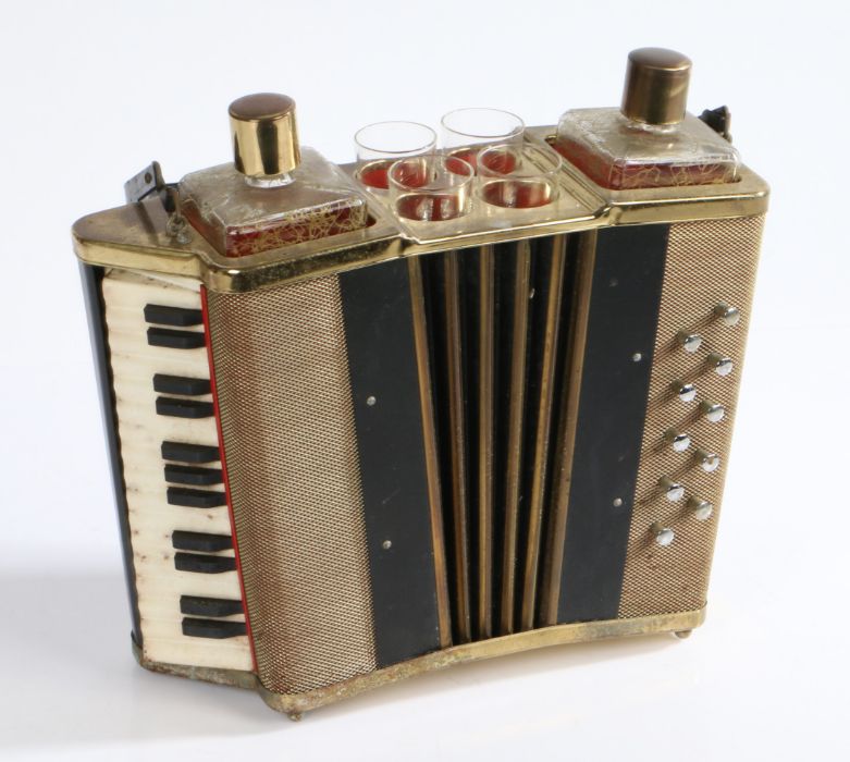 Mid 20th century novelty tantalus in the form of an accordion, housing two decanters and four