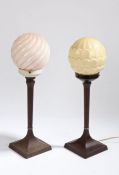 Near pair of Art Deco style bakelite reading lamps, one with cream artichoke bulb style glass shade,