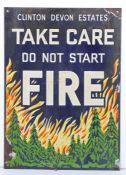 Clinton Devon Estates enamel warning sign, 'Take Care Do Not Start Fire', with a burning forest