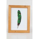 Jovel (Contemporary), a painted bird feather, signed and dated 99 to the centre, mounted in a glazed