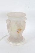 Large frosted table lamp, decorated four putti and raised on acrylic base, 31cm tall