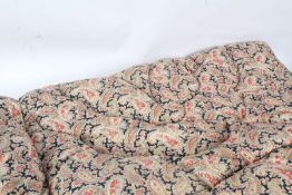 Paisley patterned quilt, with pink roses on navy ground, 150cm long, 96cm wide approx.