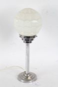 Art Deco chrome table lamp, with globular mil glass shade above a stepped chrome neck, octagonal