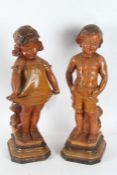 Pair of Art Deco plaster figures, in the form of a girl and boy, the boy with registration number to