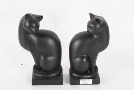 Two Artforum resin cats inspired by the works of Heinz Warneke, titled "Serenity" and "Elegance",