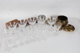 Quantity of wine glasses and champagne saucers, a small glass rose bowl and various Eastern brass