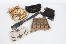 Five ladies beadwork embroidered purses, to include a late Victorian/Edwardian black bead example (