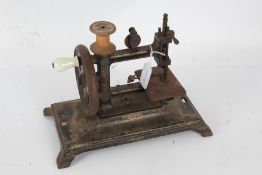 Victorian travelling sewing machine, by Leigh & Crawford of 32 & 33 Brooke Street, Holborn, 29cm