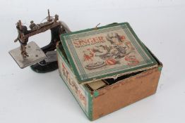 Miniature Singer sewing machine, housed in original box, with manual