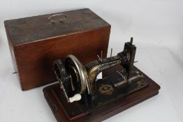 Frister & Rossman hand sewing machine, serial number 1336149, with carrying case