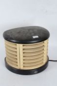 Art Deco HMV heater, housed within a bakelite case, of rounded form, 34cm wide