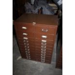 Brown metal double filing cabinet, with two banks of twelve drawers, 61cm wide, 84.5cm high, 41cm