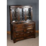 20th century oak dresser, the leaded glazed upper section fitted three doors, above two short