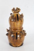 Ewenny pottery type money box, the bulbous treacle glaze money box with chicks traveling up to the