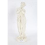 Parian ware figure depicting a scantily clad female bather beside a pedestal, 37cm high