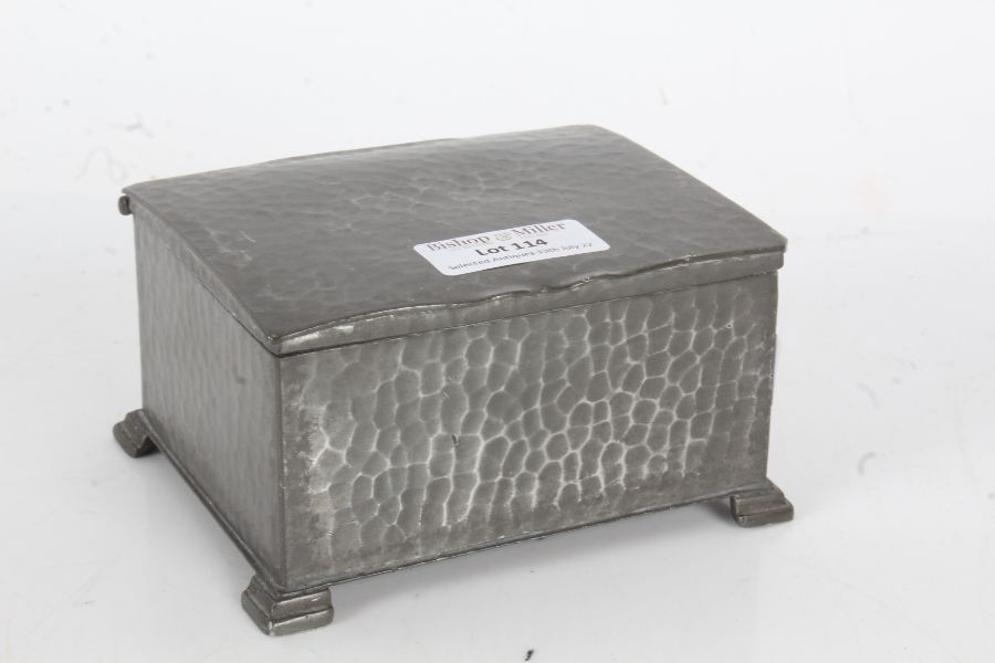 20th century spot hammered pewter cigarette box of cuboid form, the top opening to reveal a wooden