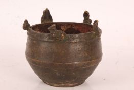 Indian bronze censer, the rim modelled with animals, the body with engraved text, 10cm diameter