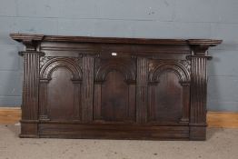 19th century oak over mantle panel, with Corinthian column design and three arched panels and carved