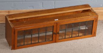 Minty glazed bookcase section, with a pair of lead glazed doors