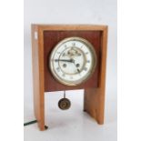 20th century mantle clock, the white dial with Roman numerals and visible escapement, 28cm high