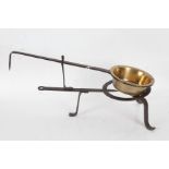 George III long handled bronze skillet, with an associated long handled iron trivet, 53cm long