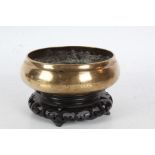 19th Century Chinese bronze censer, of plain bulbous from, raised on a pierced hardwood stand,