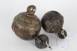 Three Indian/Tibetan graduating bells with various designs, largest 13cm high