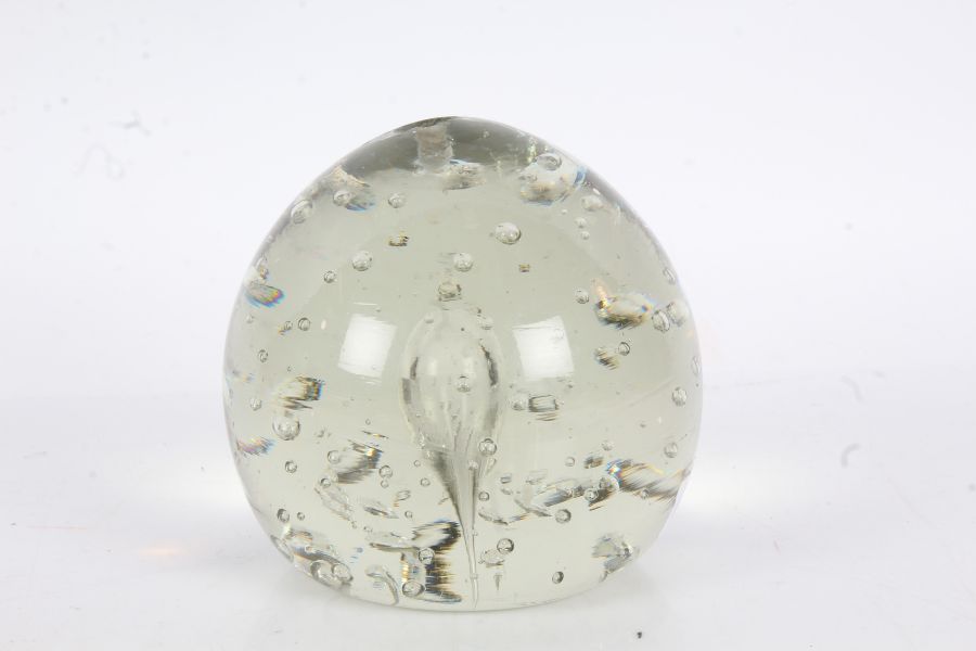 A Victorian glass "end of day" paperweight, with interior bubble decoration, 12cm diameter